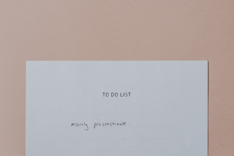 A photo of a hand written to-do list on plain white paper where the only item on the list is "mainly procrastinate"